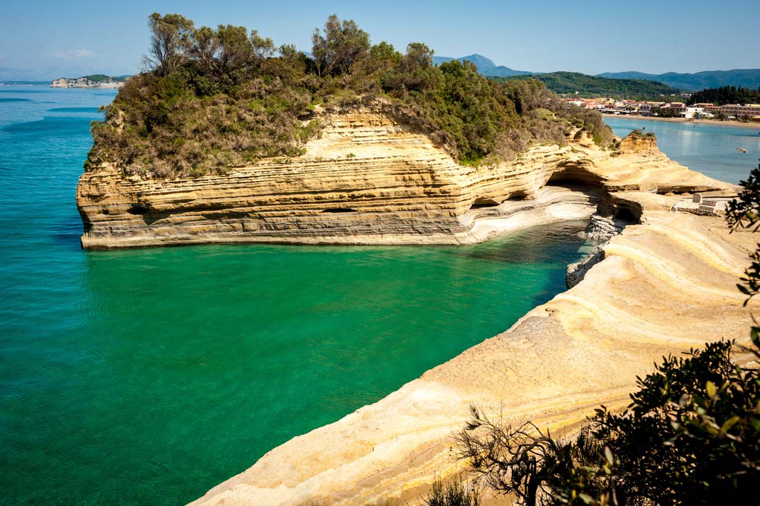 sidari-beach-coast-cana-d'-amour-caves-sand-hills-rocks-with-sand-village-tourism-restaurants-hotels-north-corfu